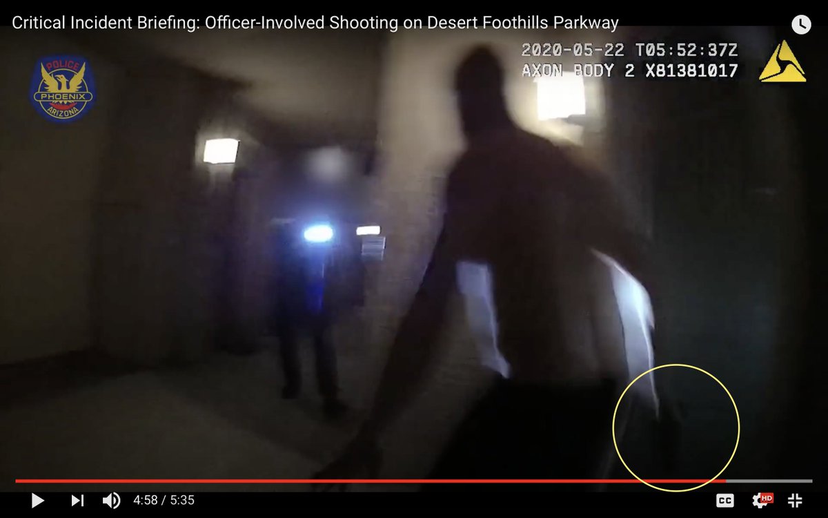 4) Man opens door holding gun in his right hand, in front of his body5) First officer yells "whoa!" after seeing the gun and begins to draw his firearm, yelling "hands, hands"6) Man then puts right hand behind his back, and now second officer sees firearm in man's right hand