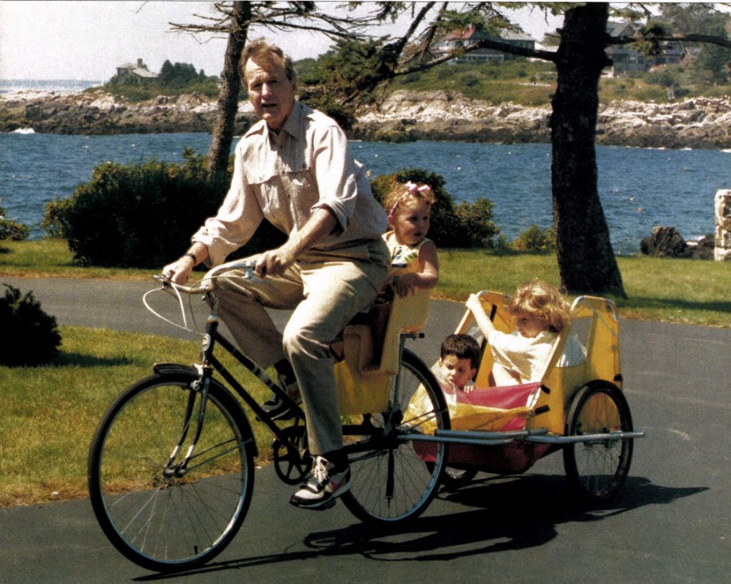 Here's Bush hauling the grandkids around by bike at Kennebunkport. Source:  https://downeast.com/features/the-bushes-at-kennebunkport/