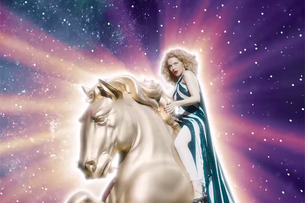 idolator's tweet photo. .@kylieminogue's "Say Something" video is a glittery, glamorous journey across the universe 🪐💫✨ https://t.co/tacL2YXZ7V