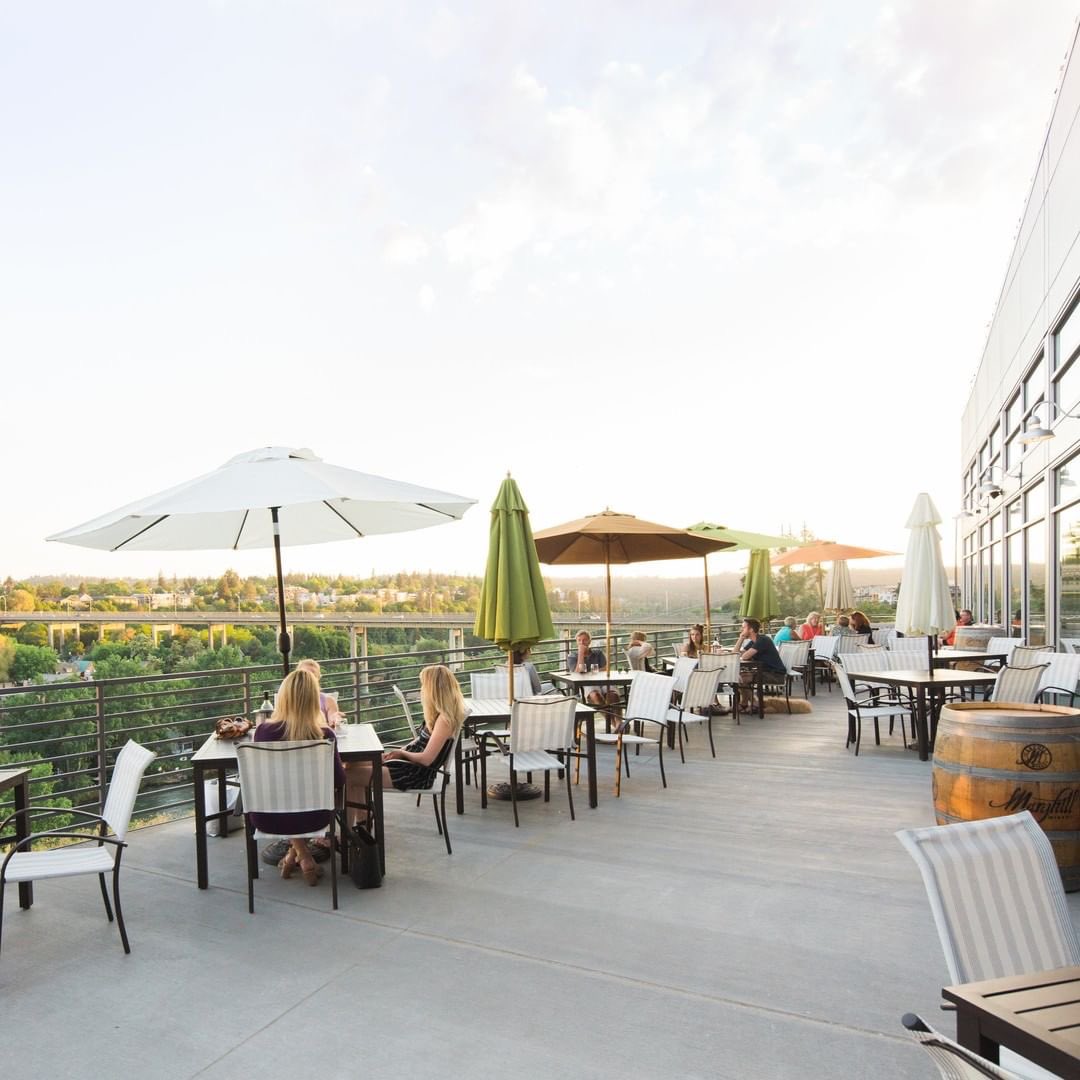 Wine is better when you drink it outside, on a balcony (or lawn, or terrace!), under an umbrella. Trust us. 🍷📸: <a href="/KendallYards/">Kendall Yards</a> #wawine #drinkwa