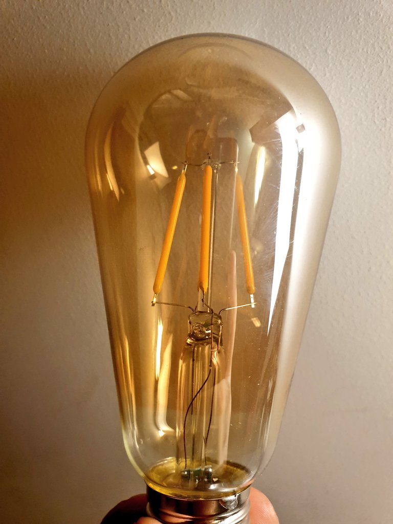 So: LED-filament v pretty, but only worth it if it's visible and not all covered up by frosted glass. Regular LED warm white is half the price. Can't tell about life (claim: 25k hours. Nonsense). For largely decorative use, there are prettier shapes (e.g 4W E27: pic4). 5/n