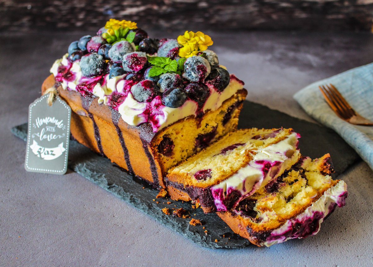 kazweedon's tweet photo. @PlayCakeBash @alicefevronia My White chocolate and blueberry loaf cake with cheesecake frosting #CakeBashChallenge https://t.co/MI1flDLZ7n