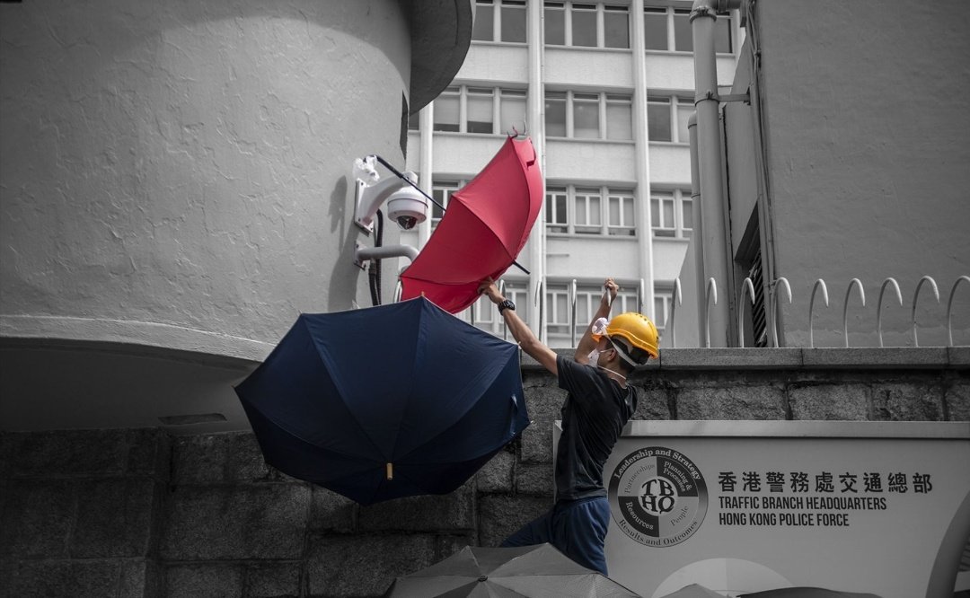 Umbrellas as Shields and Surveillance Block: