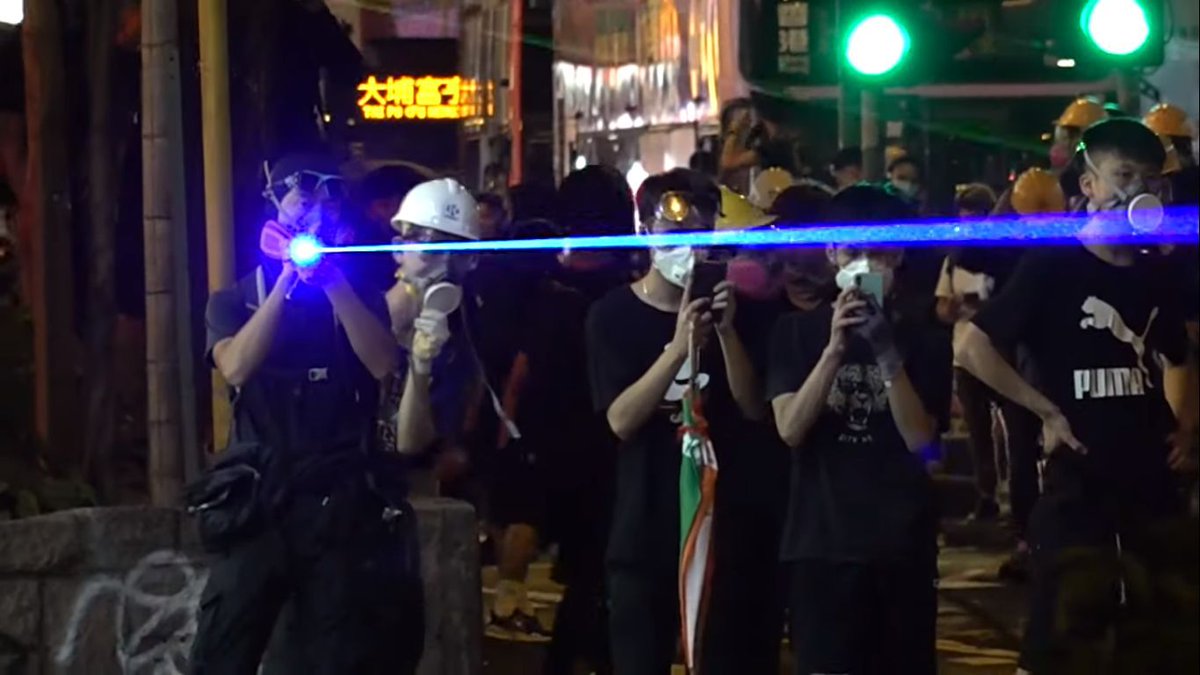 Lazer pointers: Via:  https://www.diyphotography.net/hong-kong-protesters-are-using-laser-pointers-to-confuse-facial-recognition-and-theyre-frying-photographers-camera-sensors/