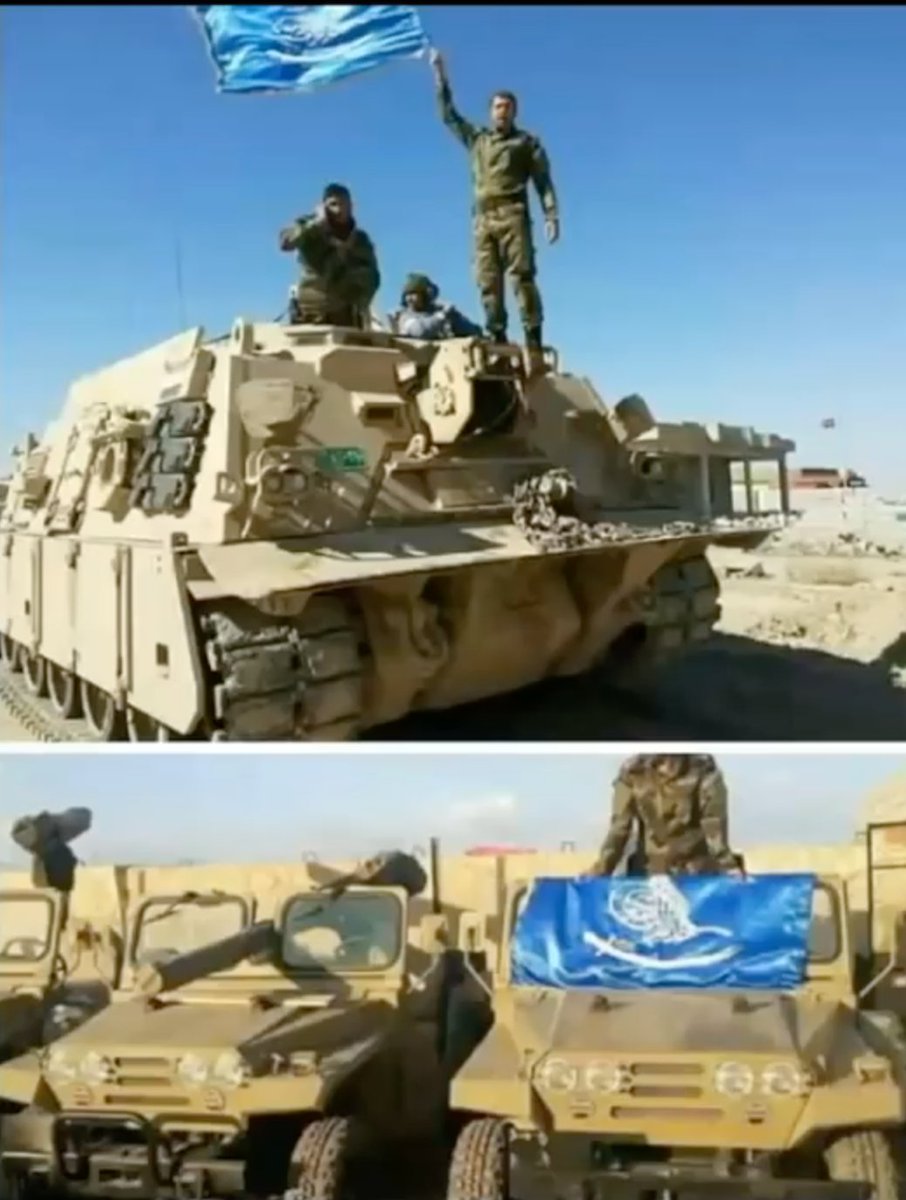 Soldiers of the Iraqi army waving the flag of Yasser al Habib's militia, Khoddam al Mahdi.