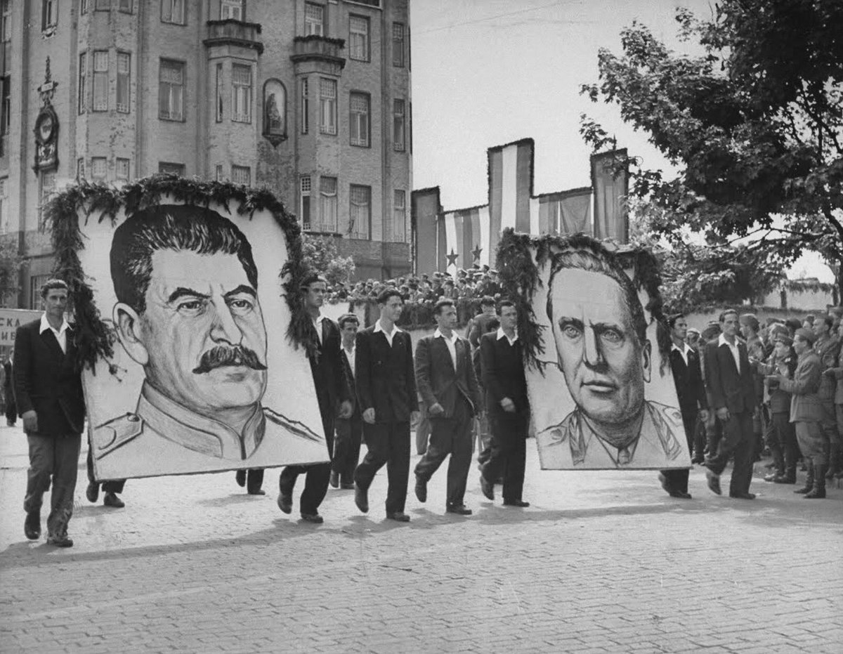 May Day in Belgrade, 1946, with men carrying posters of Tito and Stalin. Two years before the breakup.