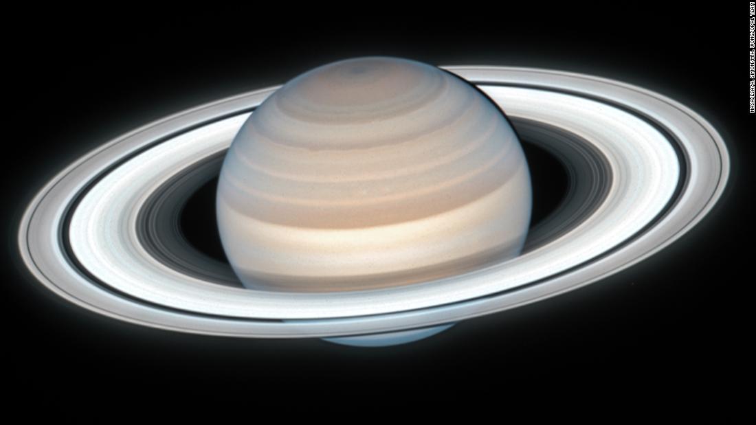 CNN's tweet photo. NASA's Hubble Space Telescope has beamed back an amazing photo showing summertime on Saturn https://t.co/qB302M4ejg https://t.co/0lH83Tc7FM