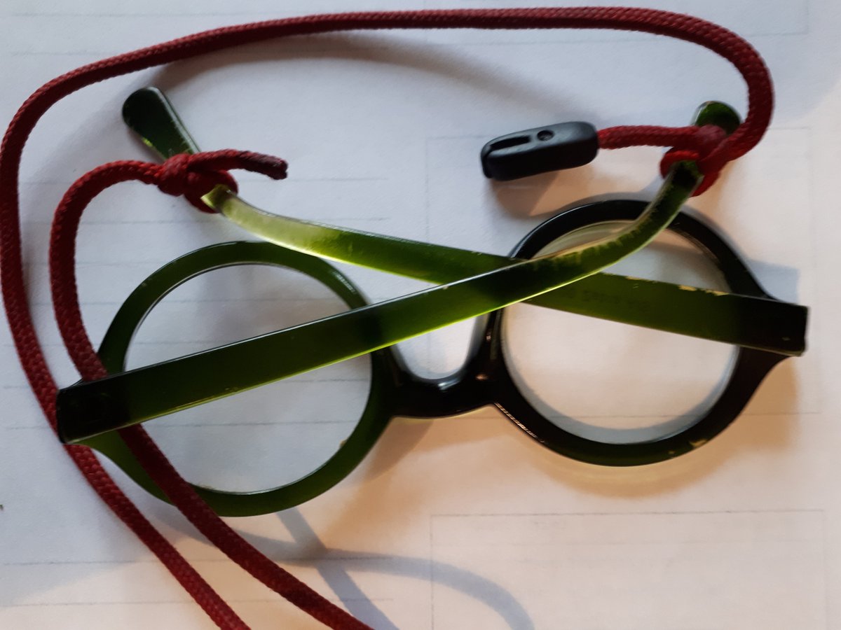 The rubber ends of my reading glasses cord have broken. Now, why would I buy a new one, when I can tie a knot in each end?