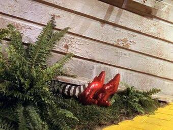 Oh, I forgot to mention. In The Wizard of Oz, Dorothy got the Silver Shoes from the Witch of East. Episode 2 is entitled “The Lady in Red Shoes” based off Hans Christian Andersen’s fairytale, but who else has red shoes?