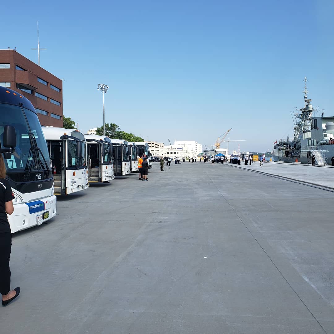 RCNintheUSN's tweet photo. And #HMCSFREDERICTON is home...the busses await. Thanks to all the dignitaries that helped welcome home Freddie today - a spectacular day all around. And thanks to the crew of the ship for their service over the last 6 months. Rest easy - see you in a few weeks. #halifaxbasecomd https://t.co/dHi6WqfDim