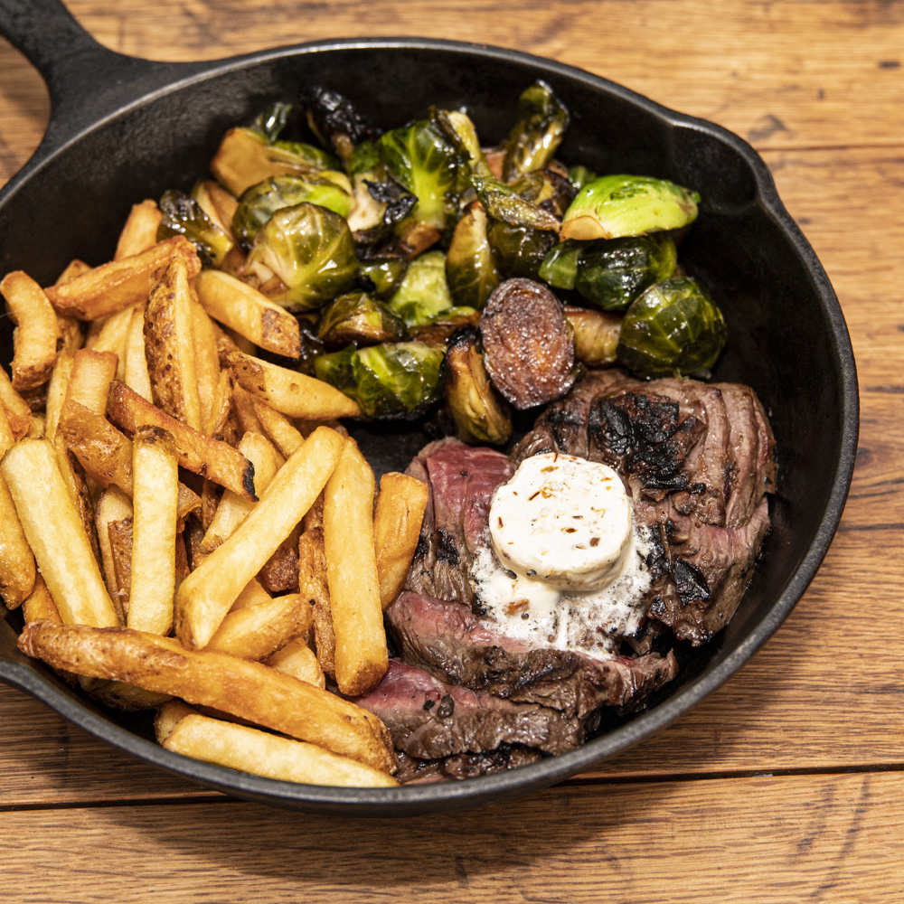 Dinner decided: A juicy hanger steak with whipped smoked butter, tasty fries, and a veggie for good measure. Yes, you want! We'll see you here. #juicysteak #fries #hangersteak #meatandpotatoes