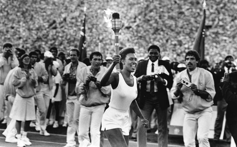 Athlete holding Olympic torch