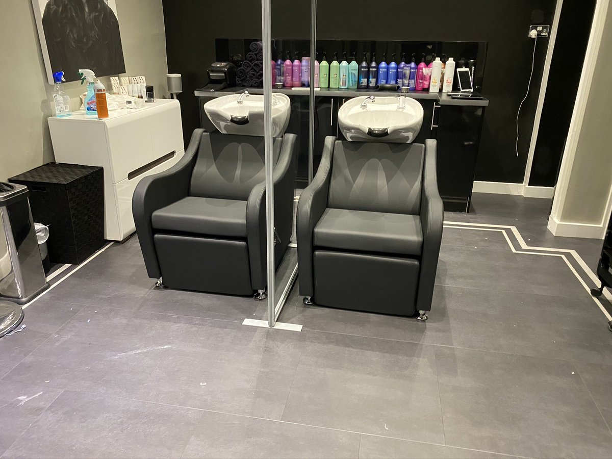 Out with the old and in with the new, changing over the head wash basins at Jason Palmer Hairdressing in Newbury