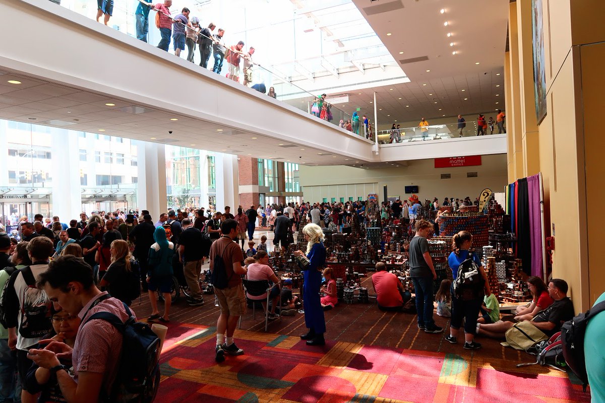FridayKnightGms's tweet photo. Some good @Gen_Con 2019 memories! #Cardhalla. Charity event since 1999. Build some structures with cards & at the end of the event launch coins to destroy the structures. #boardgamelife https://t.co/A8ZGYC4u6P