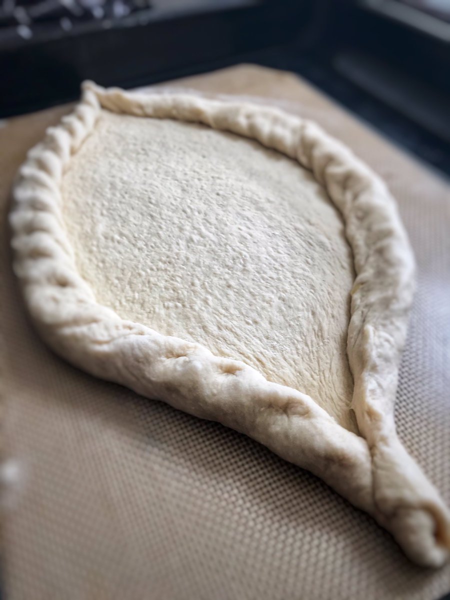 the_headteacher's tweet photo. @Mood4FoodED Just discovered #Mood4Food Here’s my first offering. Made this week - Georgian khinkali dumplings and their delicious, cheesey bread, Khachapuri. Pull off the crusts and dunk in the egg yolk. Delicious!😋 https://t.co/ZJK1wPZysY
