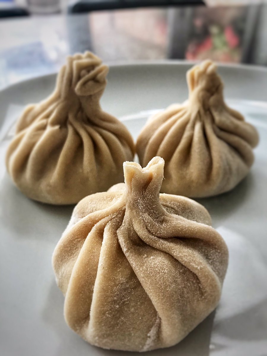 the_headteacher's tweet photo. @Mood4FoodED Just discovered #Mood4Food Here’s my first offering. Made this week - Georgian khinkali dumplings and their delicious, cheesey bread, Khachapuri. Pull off the crusts and dunk in the egg yolk. Delicious!😋 https://t.co/ZJK1wPZysY