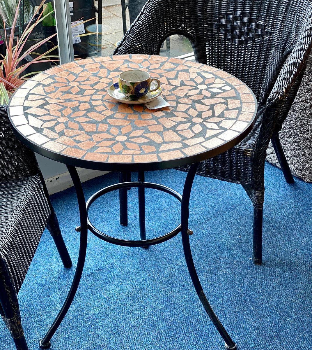 AnchorCharity's tweet photo. Moroccan orange outdoor bistro table at the @AnchorCharity shop in shirley, Solihull make the most of your outdoor space this summer #staycation #charityshop https://t.co/m9pDdIWxGf