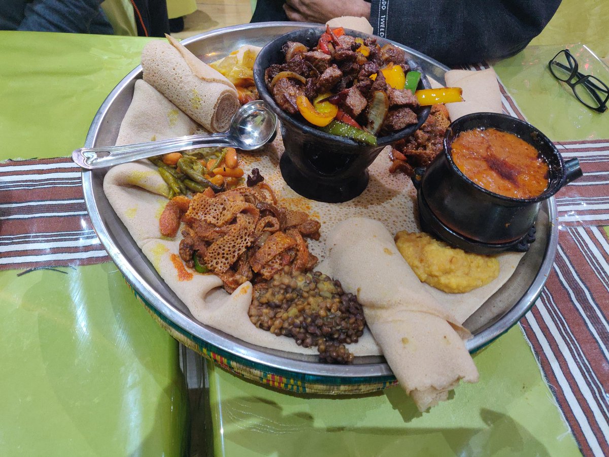 Ethiopian Food at MerkatoThe world knows about the famous injera bread - fermented, fluffy, made with teff flour and eaten with various accompaniments. We had it with dereq tbsi (sauteed beef with tomatoes, pepper, onions), baldonga (split chickpea stew, lentils and greens.