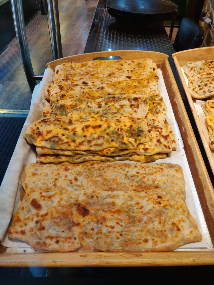 Gozleme at Petek PatisserieMy go to place every time I crave aloo paratha. Makes me wonder, did paratha came to us from the Turks? Gozleme is basically flat bread roasted on a pan stuffed with potatoes, spinach and cheese, chicken or beef.