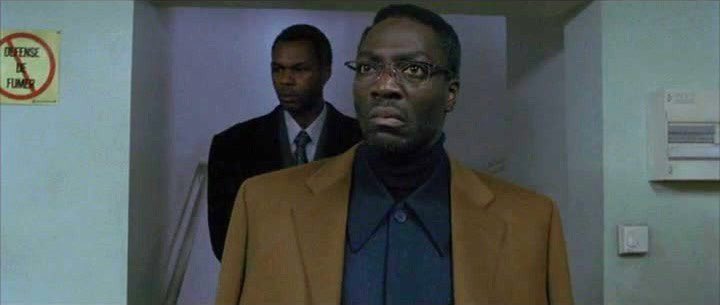 Wombosi is a composite of Idi Amin and Mobutu Sese Seko, and the latter wore glasses. But, importantly, Gilroy’s script (which is incredible) is very intentionally building on a type of Black man the white supremacist patriarchy especially hates. https://twitter.com/ryanjkingston/status/1288492738346979329?s=21  https://twitter.com/ryanjkingston/status/1288492738346979329