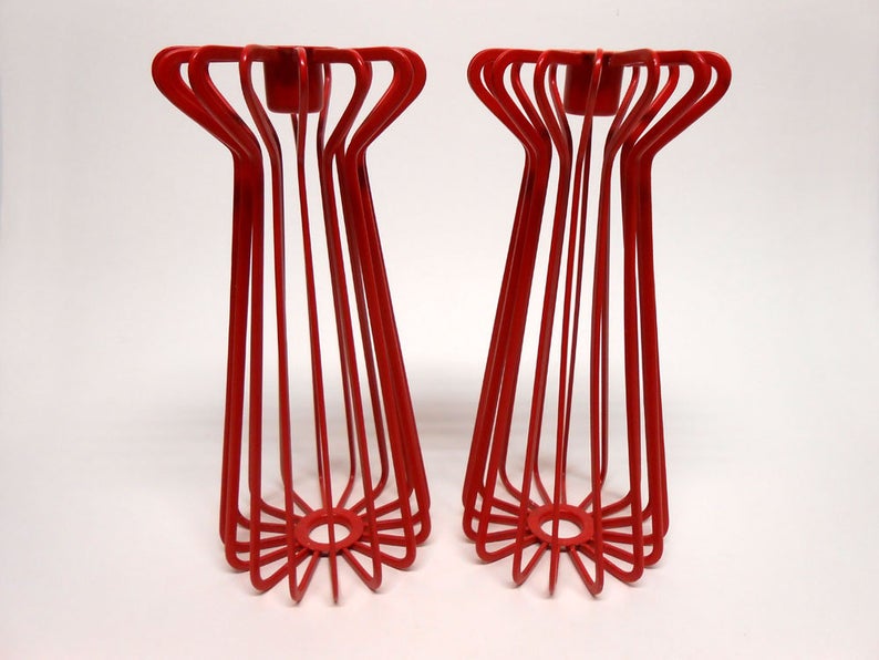 these '90s Ikea metal candlesticks don't totally "go" in my apartment but they're really cool. $32 for the pair  https://www.etsy.com/listing/700439605/ikea-red-metal-wire-candlesticks-holders?ref=user_profile&cns=1