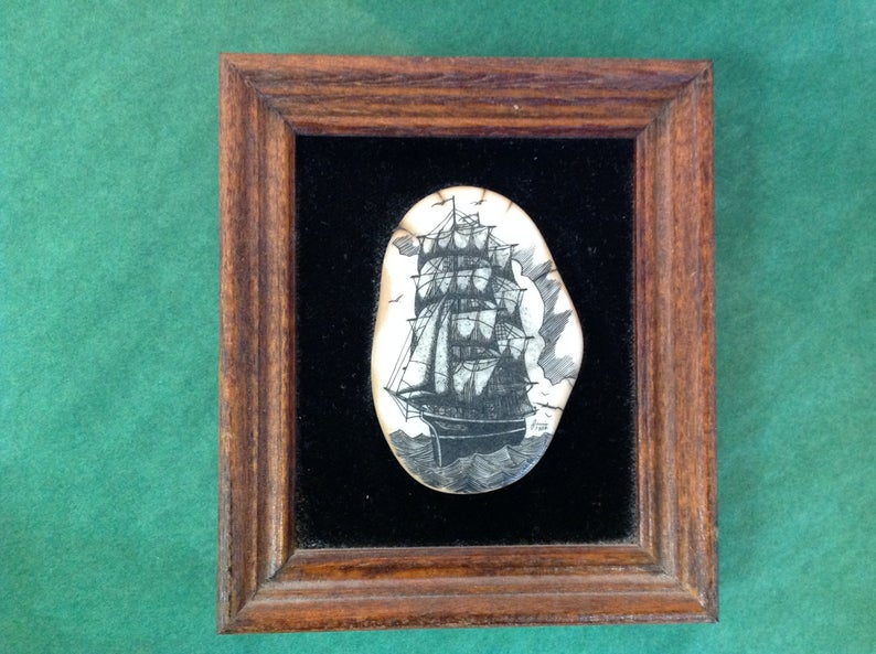 absolutely sick bit of scrimshaw, set in velvet and framed. $295. i would accept this as a gift  https://www.etsy.com/listing/829865329/vintage-framed-scrimshaw-tall-sailing?ref=user_profile