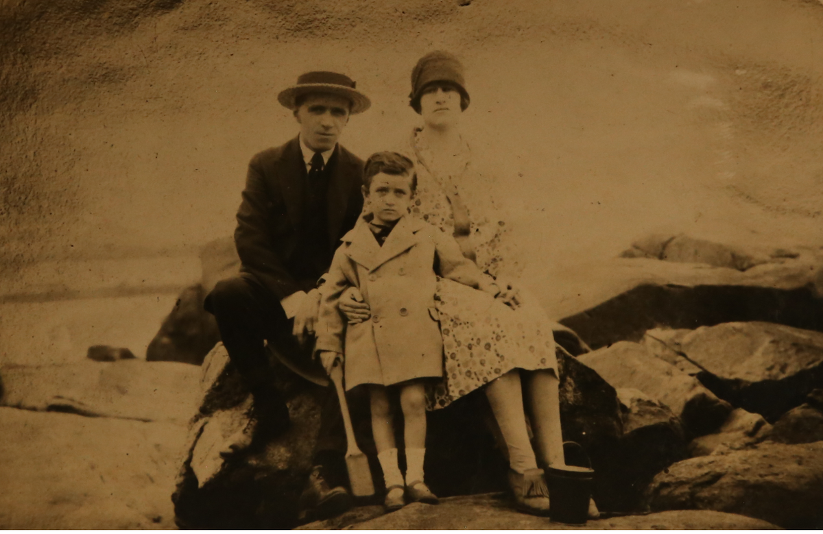 This might be the only photo of him I've seen with both his parents. She looks truly happy with babies in her arms in some of these photos, but this one is strikingly dour. No one looks happy to be at the beach. This is her husband, Valentin, who had her committed.