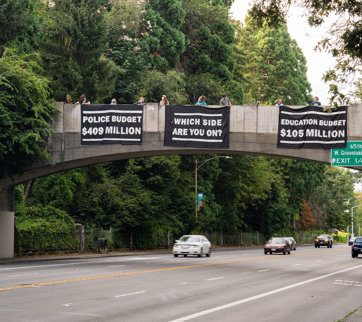 Hi <a href="/CMDanStrauss/">Councilmember Dan Strauss</a> 👋
We’re still out here in your district, reminding Seattleites just how massively overfunded our city’s police department is. Can’t tell you how many thumbs ups and supportive honks we got 👍

Vote to defund!!
✊✌️
#BlackLivesMatter #DefundSPD #FreeThemAll