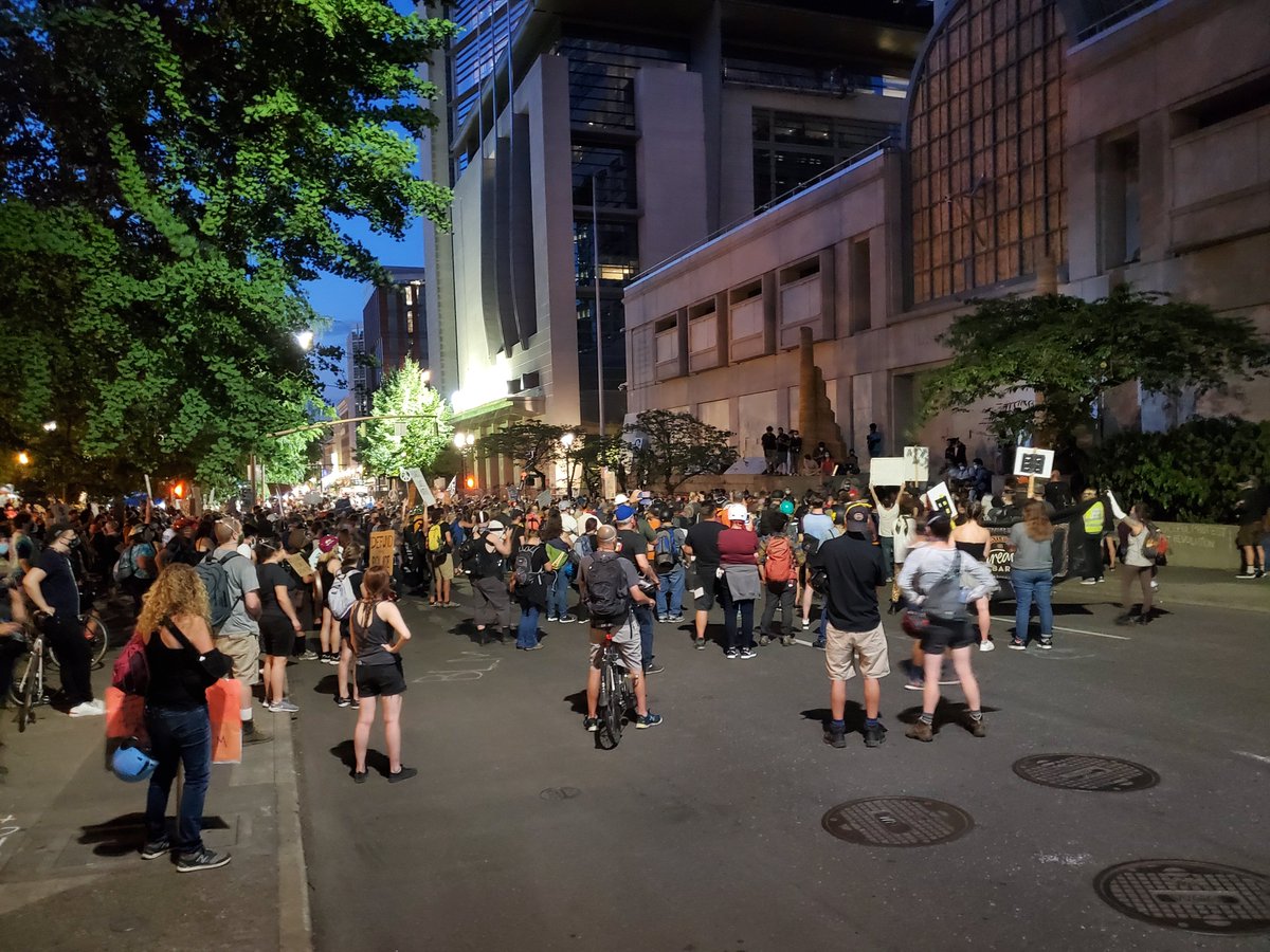 Several hundred people in the parks/street in front of the Justice Center and federal courthouse right now.