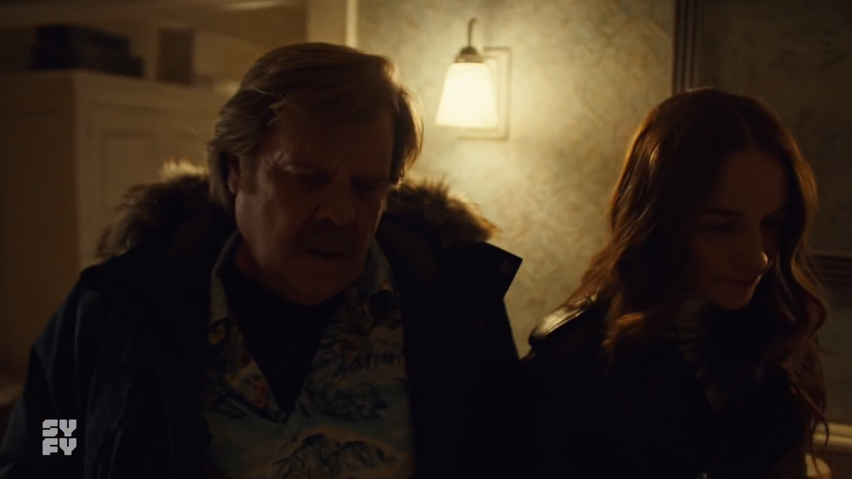 Varun would have to be following the camera from the kitchen back door all the way to the other end of the hall. In reality, Mel & Greg are seeing Varun shuffling by with a KNIFE, not a wall carving!