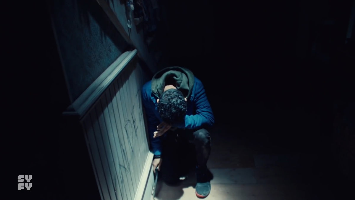 Even though it's dark & hard to see, Mel has vanished from behind Jeremy. Likely through the doorway in the rear of the scene and around the corner.