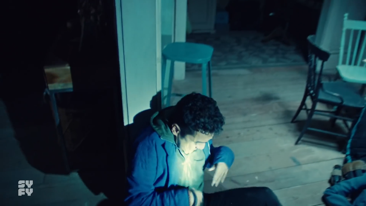 Jeremy is then tasered and falls back against the doorframe that separates the hallway and kitchen.Mel at this point would be back in the hallway waiting for the scene to change back. It's dark, so she would be obscured even if the camera managed a corner of her.