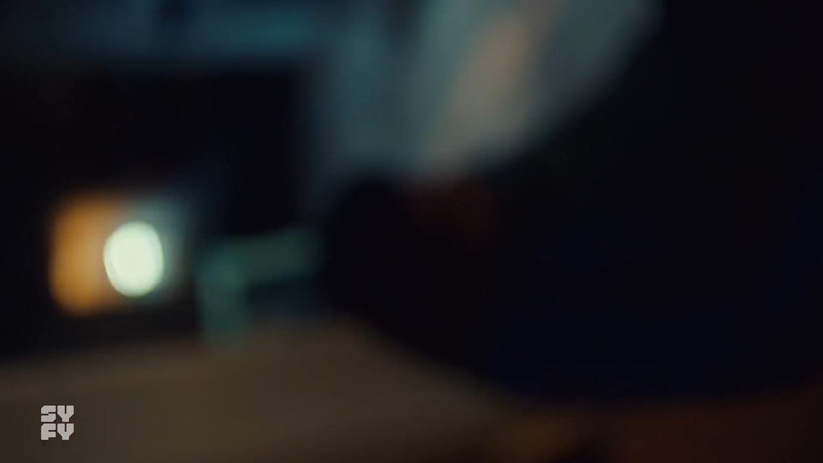 The lighting begins to change back as the camera rolls to the right and unfocuses.