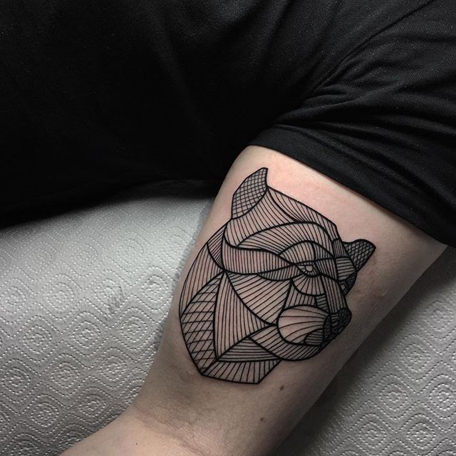 Dolphin and beer tattoo on the bicep