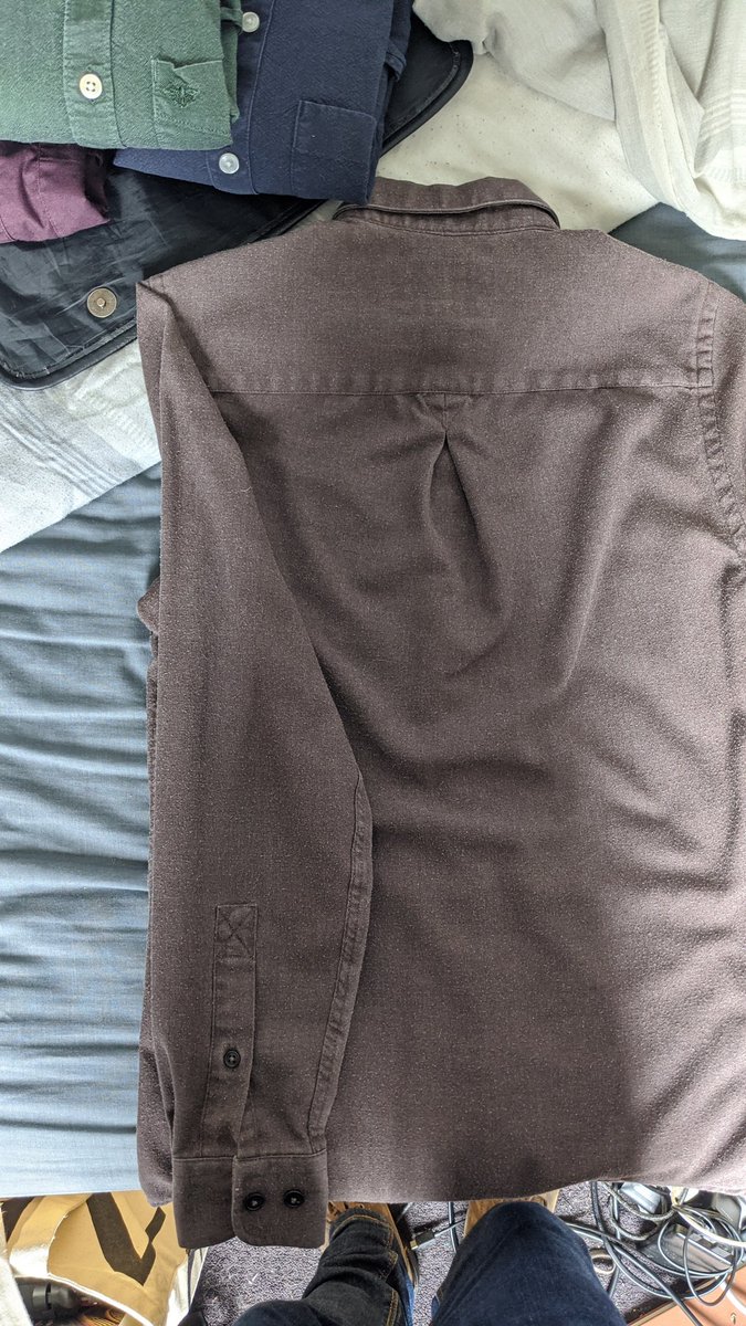 Step four: fold the damned sleeves thusly - folding from the seam.