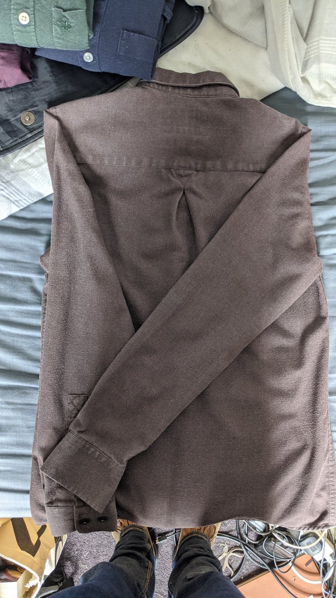 Step four: fold the damned sleeves thusly - folding from the seam.