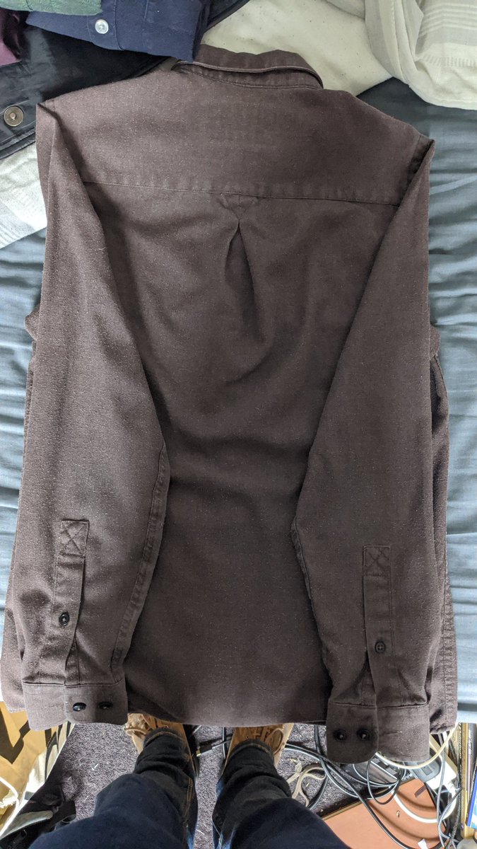 Step four: fold the damned sleeves thusly - folding from the seam.