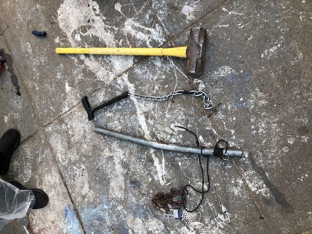 PortlandPolice's tweet photo. A sledge hammer, improvised weapons, leaf blowers, helmets, chest and leg armor, and fuel canister are some of the items recovered in Chapman and Lownsdale Squares this morning. https://t.co/QXnppztBU6