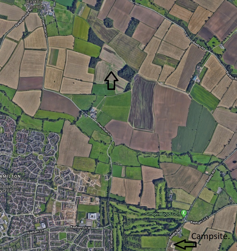 google earth as an area where three hedges converge but don't meet. The campsite can be seen in the lower right hand corner of the second image. To the south of the former Bell Lodge site, a farm complex can be seen called Hamilton Farm or Hamilton Grounds. This area was used /7