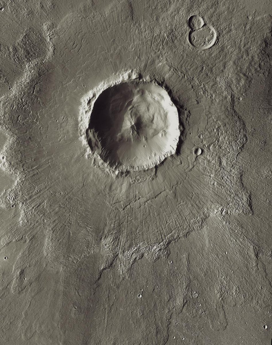 There are craters all over the surface of Mars. The more craters a surface has, the older it is. Here's an example of a crater, Bacolor Crater, which is about 20 kilometres wide! (2/2)  @MarissaLoBot