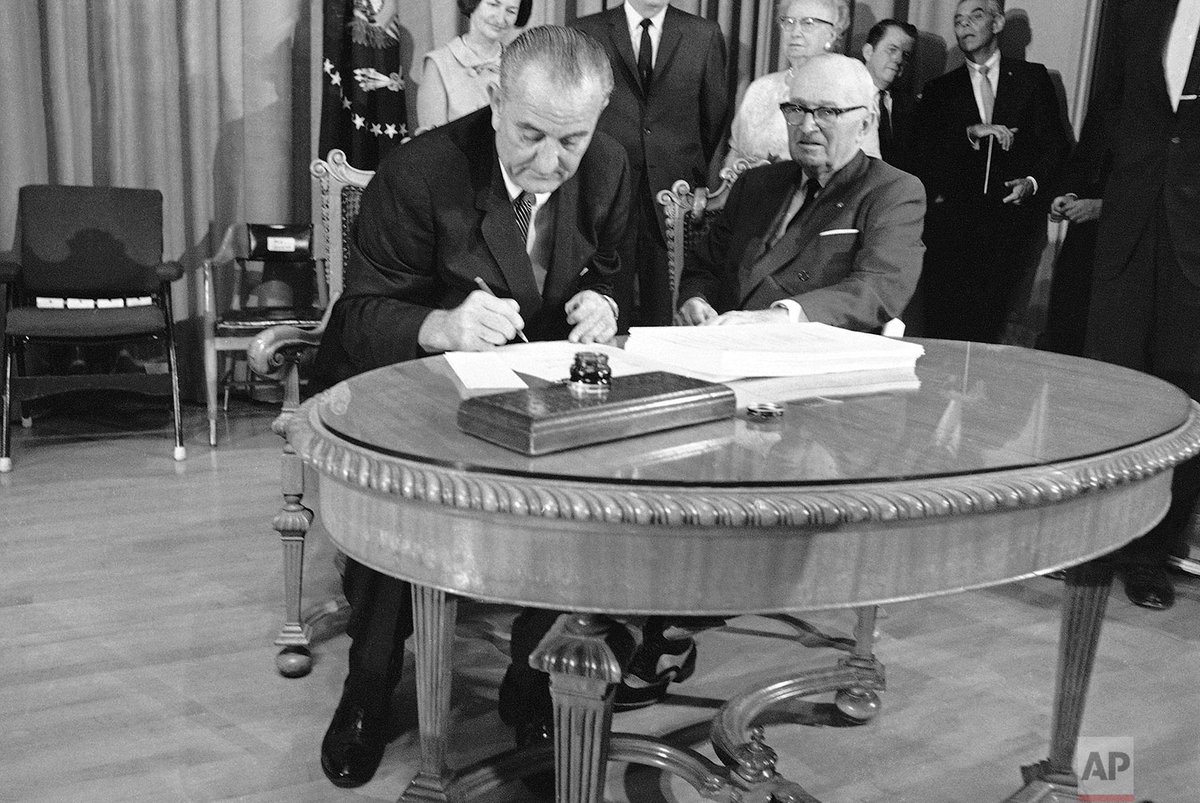 AP_Images's tweet photo. 55 years ago today, President Lyndon B. Johnson signed a measure creating Medicare, which began operating the following year. #OTD https://t.co/EFmlsnjCAQ