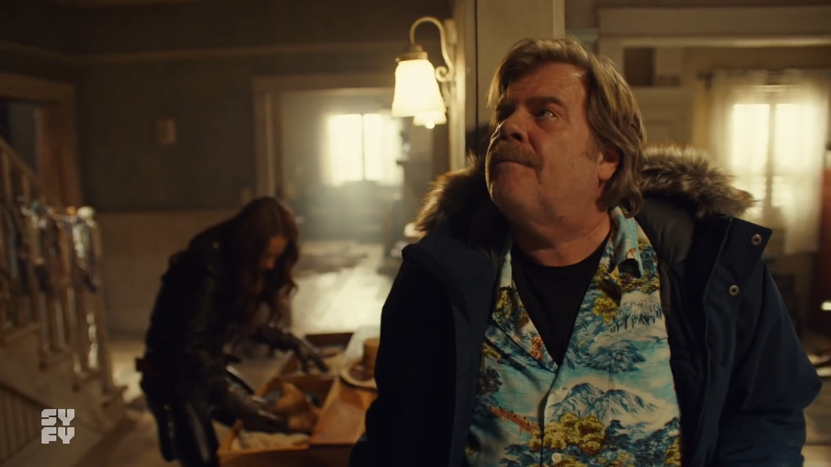 I woke up at 3am & groaned. It makes no sense for Varun to come in the back door & follow the camera. Instead, he would be waiting in the living room, where Mel would later escape to.Why risk wrecking the shot, when you can easily hide?I'm thinking way too hard about this...