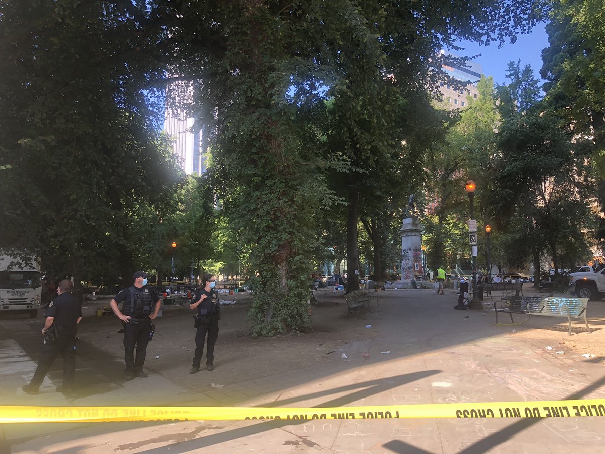 Lonwsdale and Chapman squares being cleared at the request of Oregon State Police. Groups of Portland Police officers are stationed at every corner around Chapman Square.