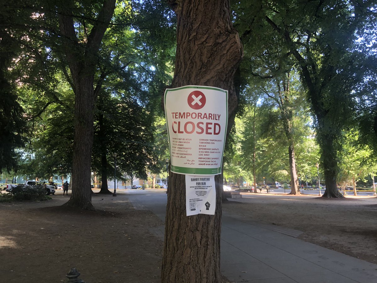 A park closure sign, along with some others around the park. &ndash; bei  Chapman Square