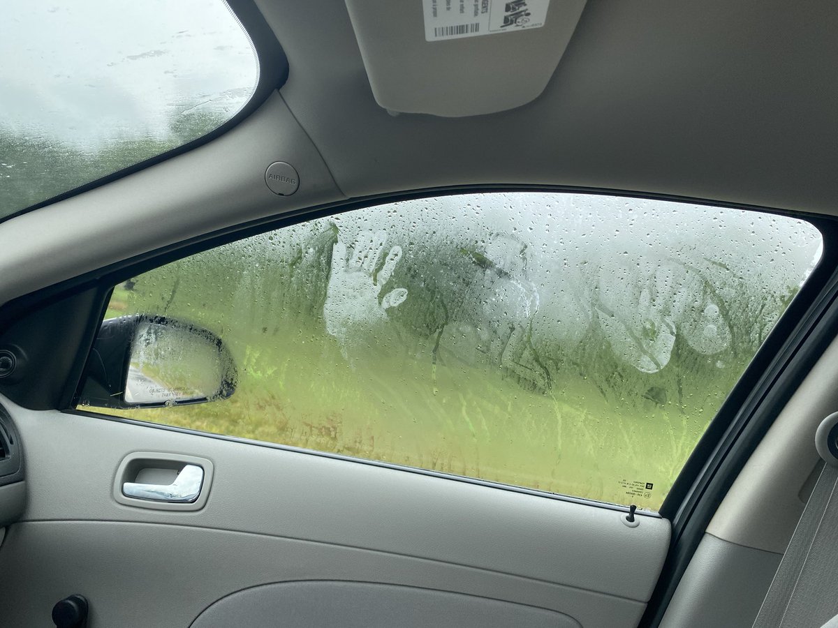 I am so genuinely terrified. I was just driving and obviously it’s raining but I just looked over and this appeared on my window. Wtf. Someone help me.