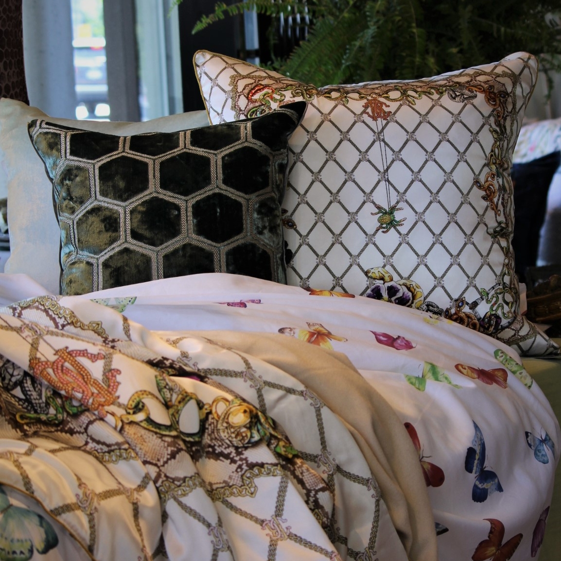 Clever design is about juxtaposing contrasting elements while keeping harmony in the composition. Whimsical butterflies work surprisingly well together with vibrant spiders and snakes to create this unique bedding. 

#finolinovancouver