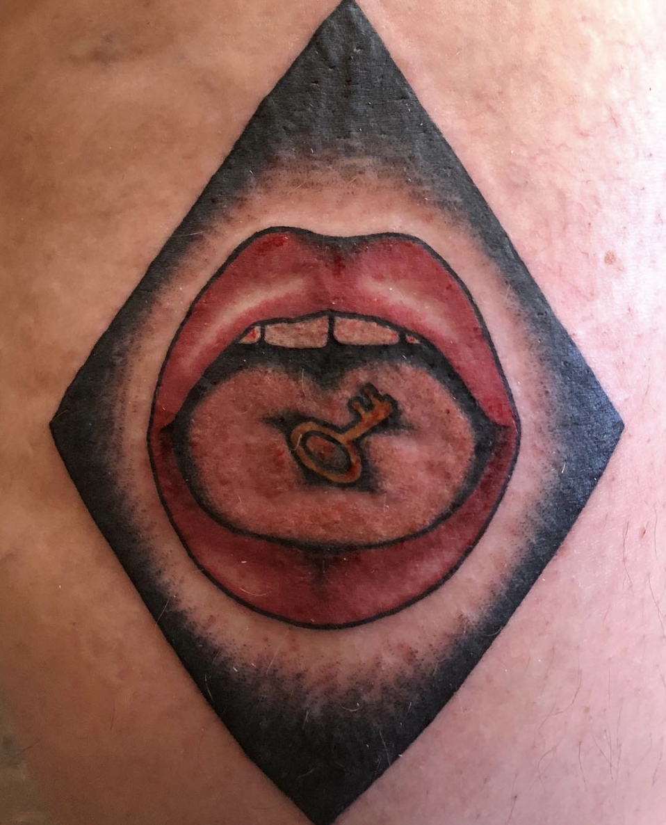 Happy birthday to kate bush my favorite singer of all time whose mouth I have tattooed on my leg 
