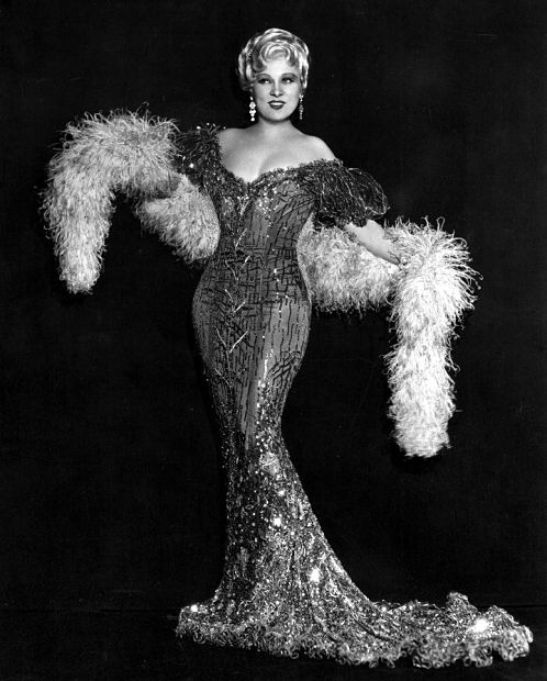 Edith was captivated by Mae from their first meeting. Mae wore a clingy white dress cut down to the navel—at 10.00 in the morning. Mae told Edith ‘I want my clothes loose enough to prove I’m a lady, but tight enough to show ‘em I’m a woman’.