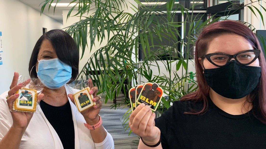 nwcenter's tweet photo. Northwest Center celebrated new Equity initiatives with a fresh #BLM design on stickers &amp; printed on delicious cookies from @JussFlyyEvents.
Unveiling the new designs are Cheryl Keyes, Reception Program Manager on the Amazon campus, &amp; designer Anna Nelson, Receptionist at Amazon. https://t.co/d6azMebyuC
