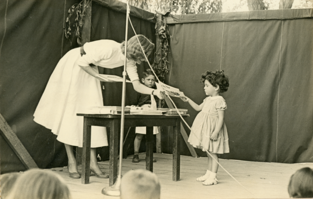 as a reminder that not everything is terrible, here is my mother proudly graduating from preschool